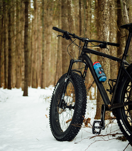A fat tire bike standing in snow