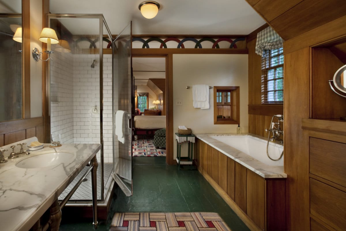 bathroom with bathtub and shower