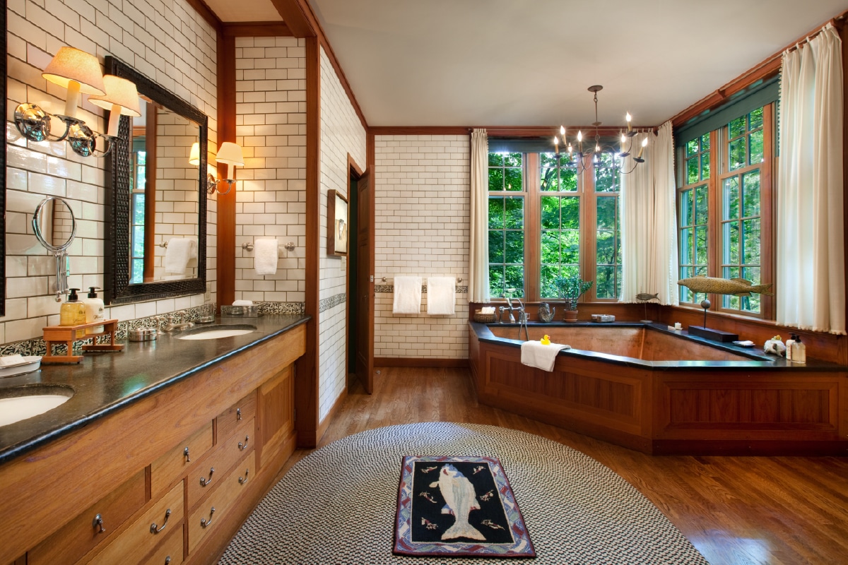 Bathroom with double sinks and large bathtub