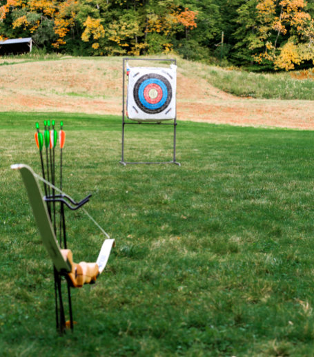 A woman throwing an axe.